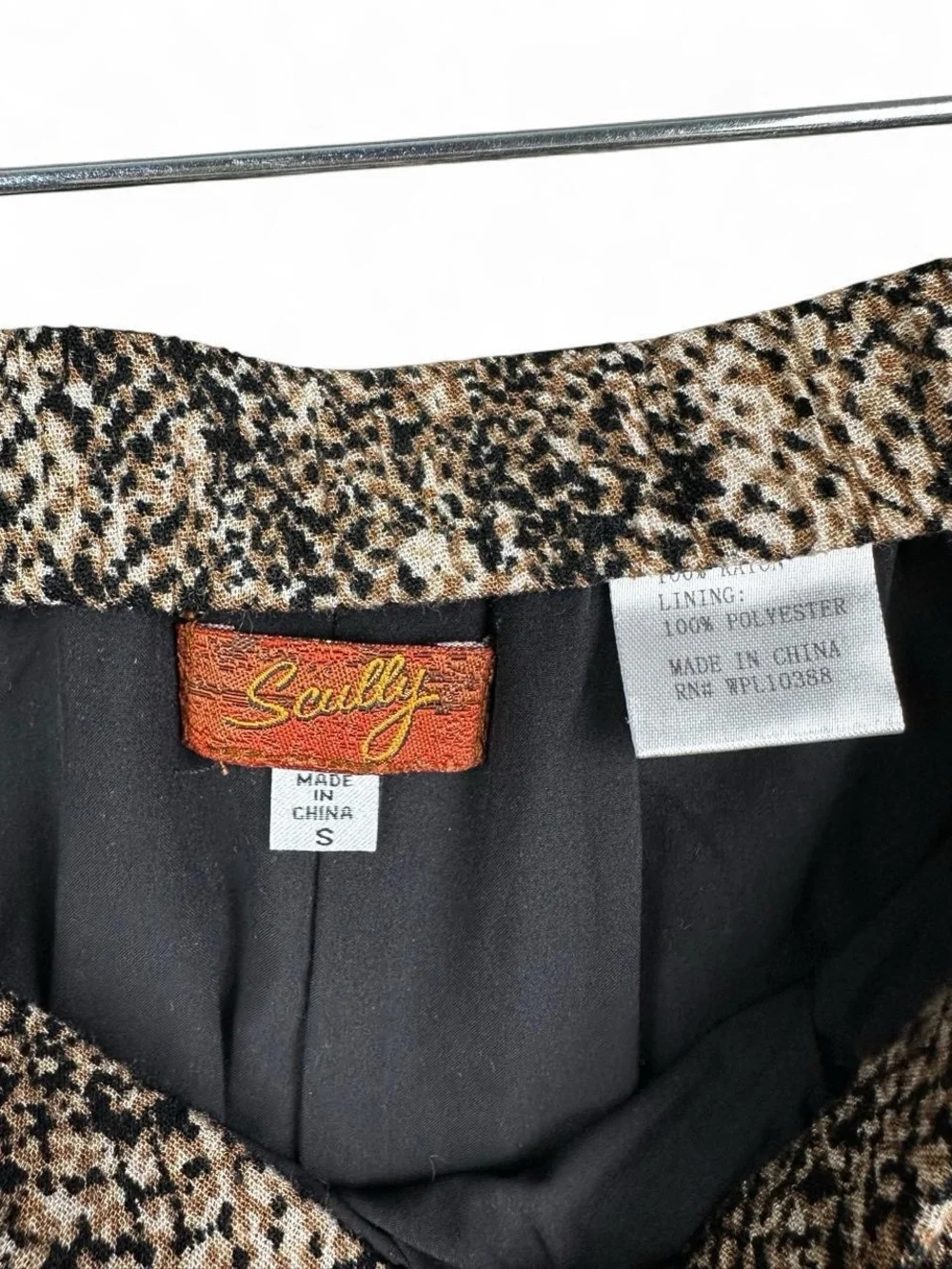 Scully black and beige snake print polyester mini skirt with ruffle hem